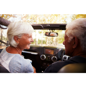 man and woman behind the dashboard of a car